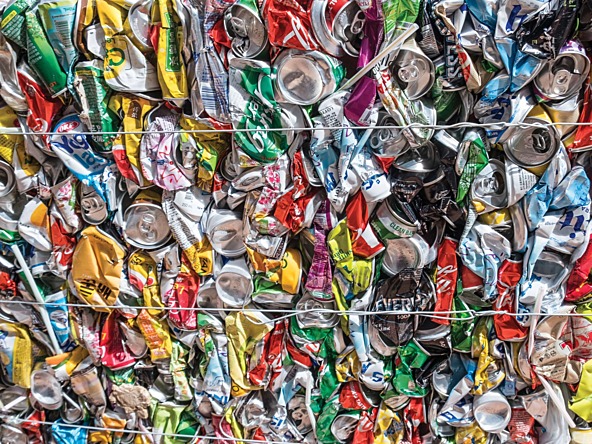 multi-coloured aluminium cans crushed into a block